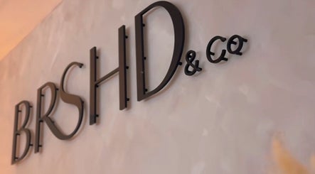 Elegant signage at Crowned Hair by Emily, Carlisle, England, GB showcasing BRSHD & Co logo.