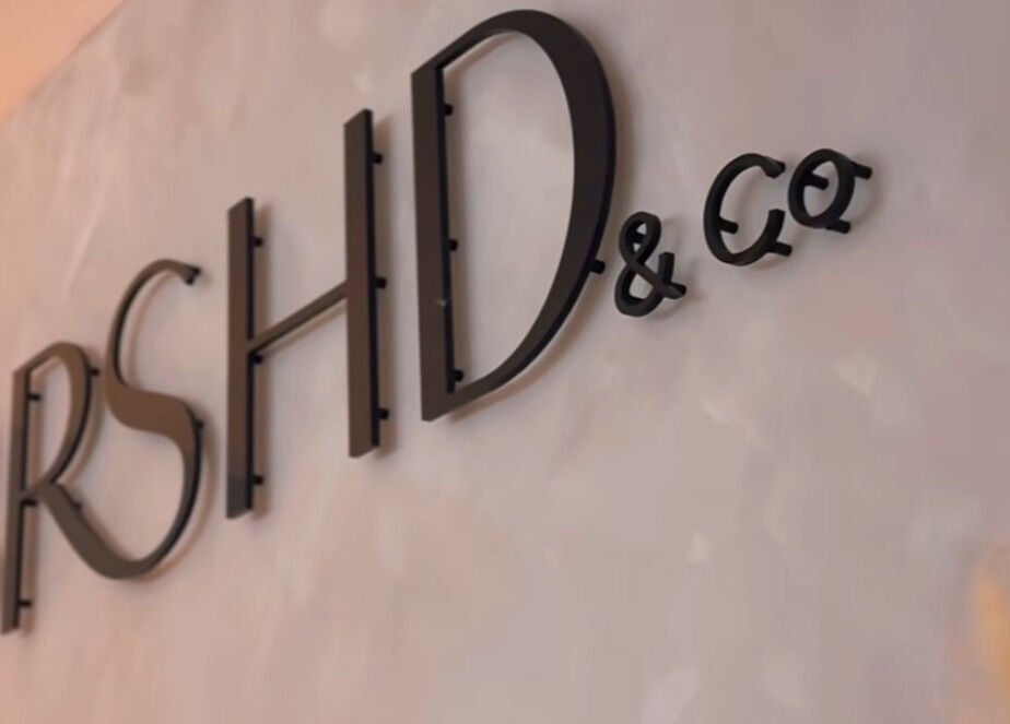 Stylish signage of Crowned Hair by Emily at Carlisle, England, GB, enhancing salon elegance.