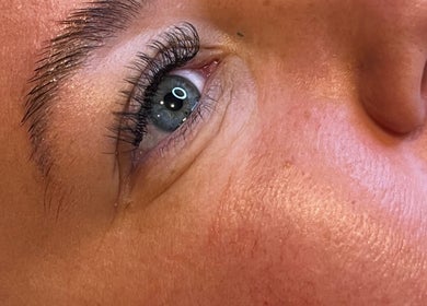 Close-up of enhanced eyelashes at Oohlalash, St Helens, England, GB showcasing precise beauty treatments.