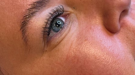 Close-up of enhanced eyelashes at Oohlalash, St Helens, England, GB showcasing precise beauty treatments.