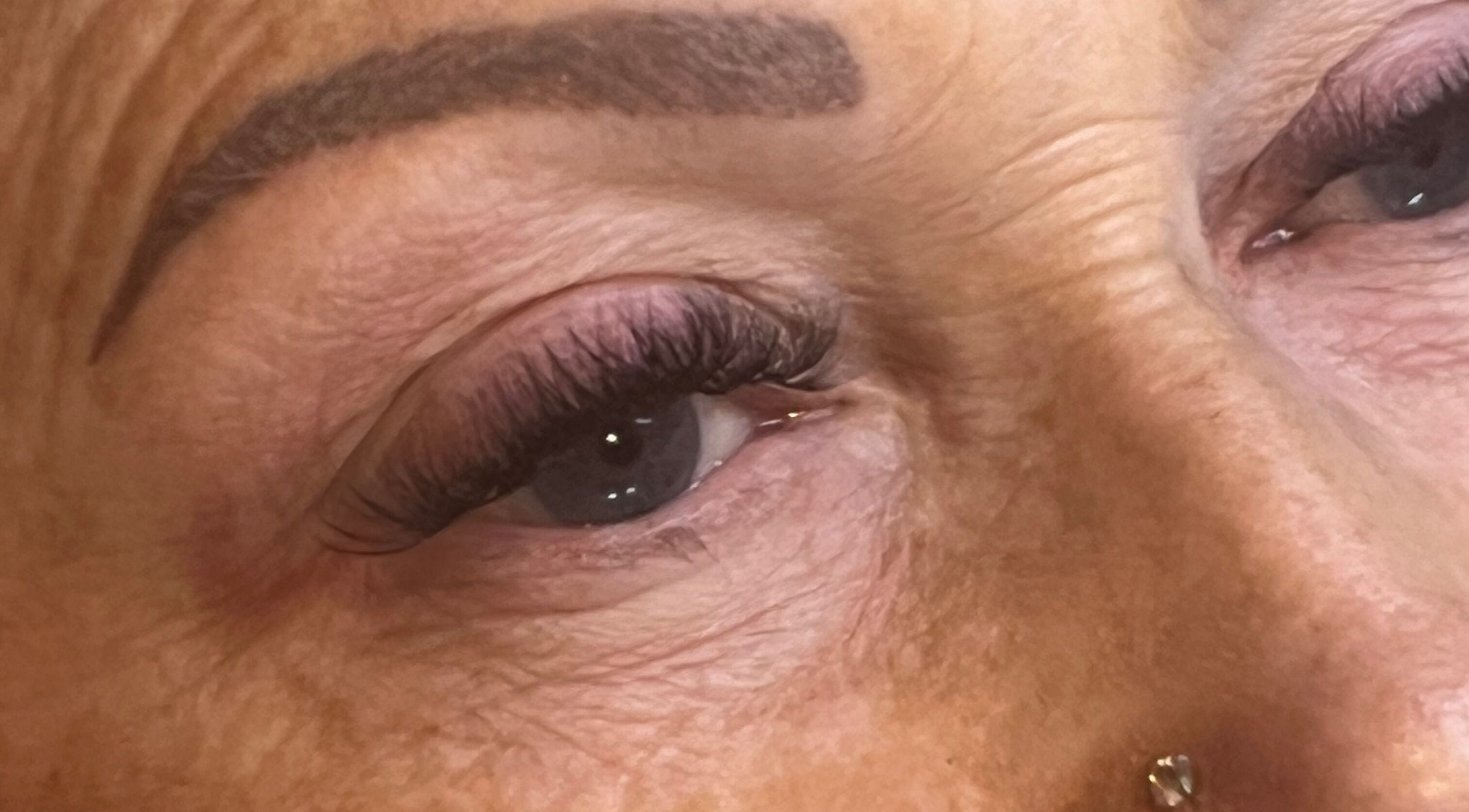 Close-up of enhanced eyelashes at Oohlalash, St Helens, England, GB. Showcasing precision beauty services.