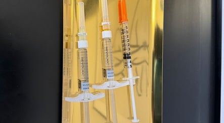 Kaesthetics London syringes for cosmetic treatments in London, England, GB displayed against a gold background.