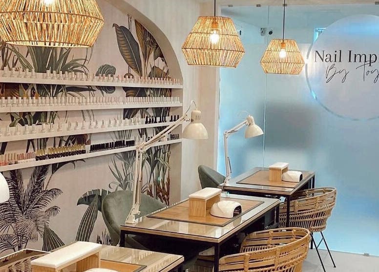 Elegant nail salon interior at Nail Impress by Toyah, In-naxxar, Malta, MT featuring stylish decor and workstations.