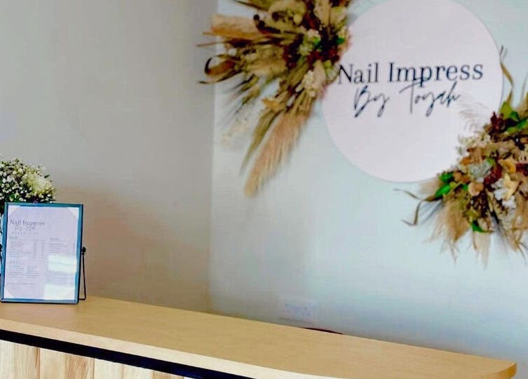 Reception area of Nail Impress by Toyah in-naxxar, Malta, MT, featuring floral decor and a welcome desk.