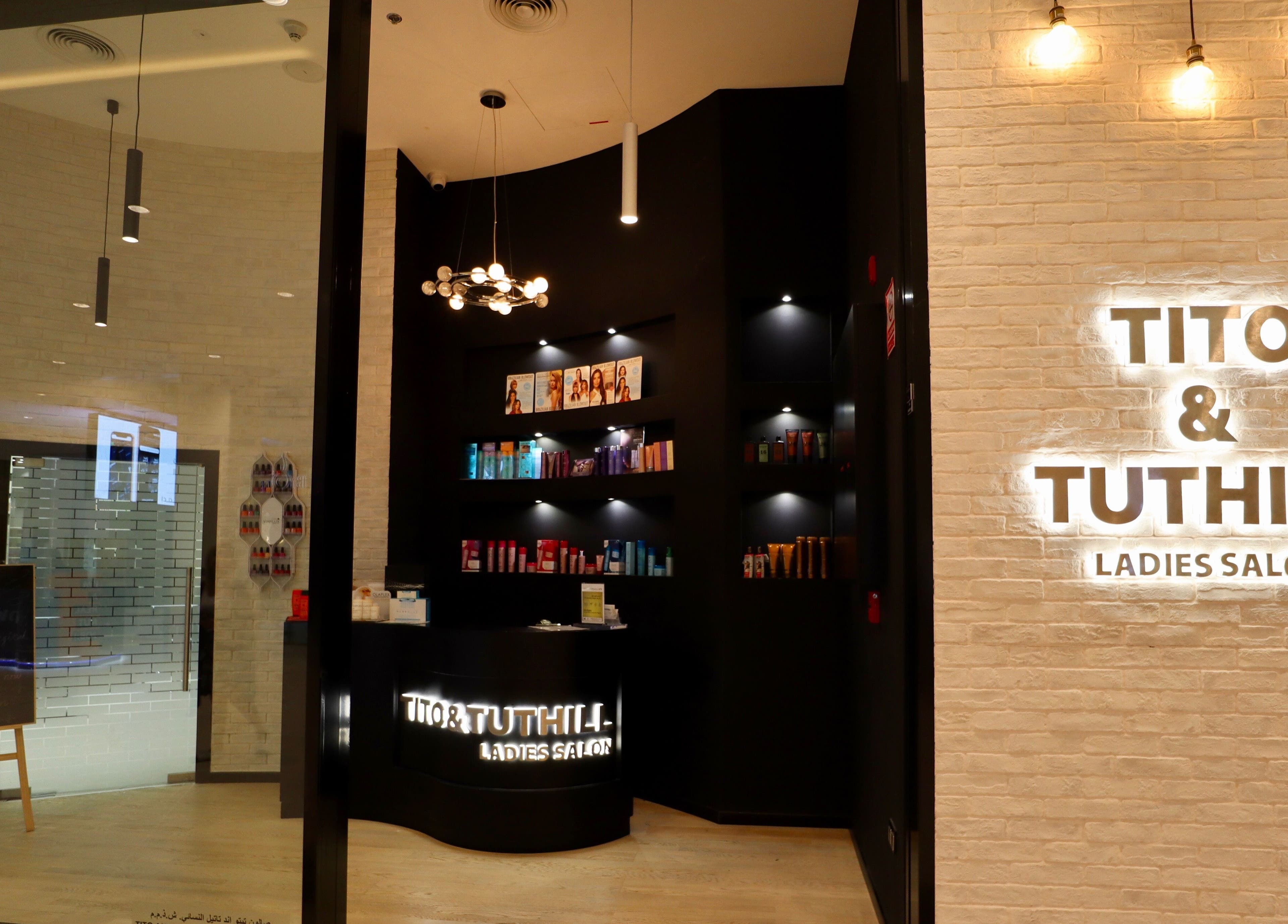 Chic interior of Tito & Tuthill Ladies Salon in Dubai, AE showcasing products and elegant lighting design.