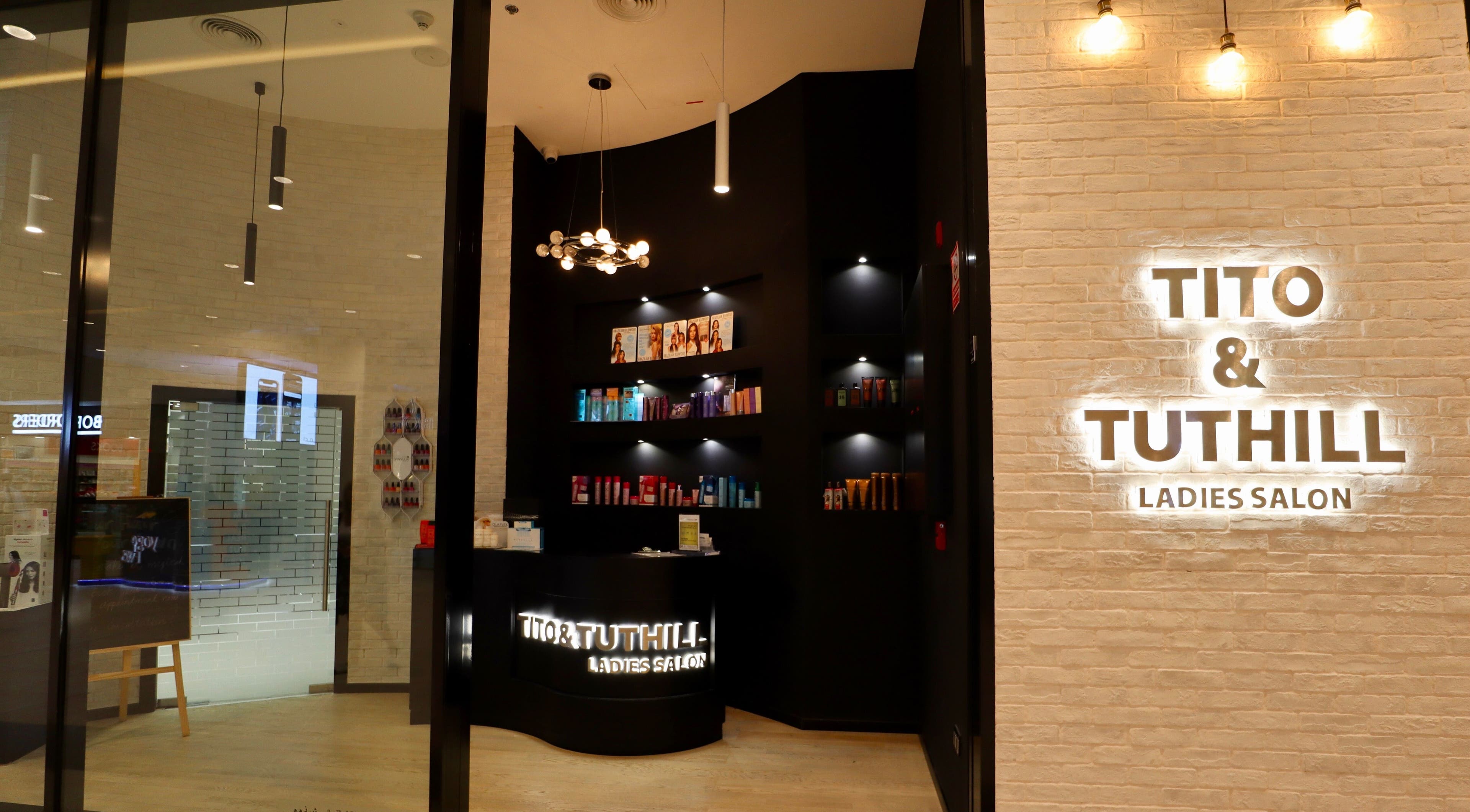 Chic interior of Tito & Tuthill Ladies Salon in Dubai, AE showcasing products and elegant lighting design.