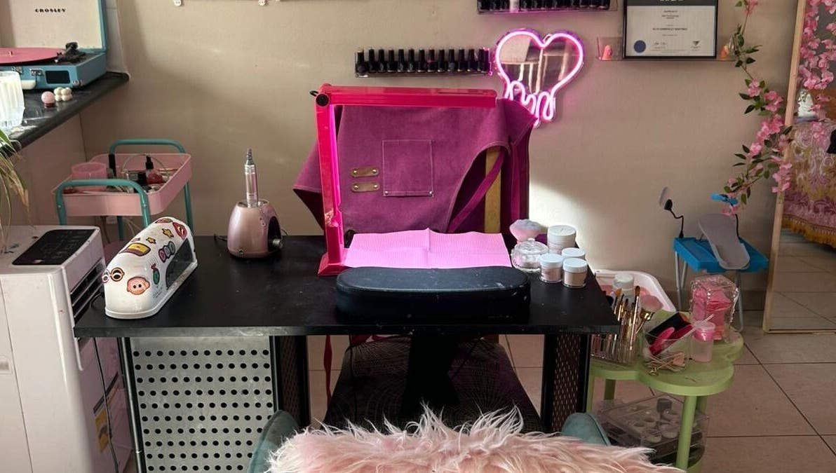 Elegant nail station at Nails By Ruth Kimberley, Merrylands, New South Wales, AU. Cozy setup with pink decor.