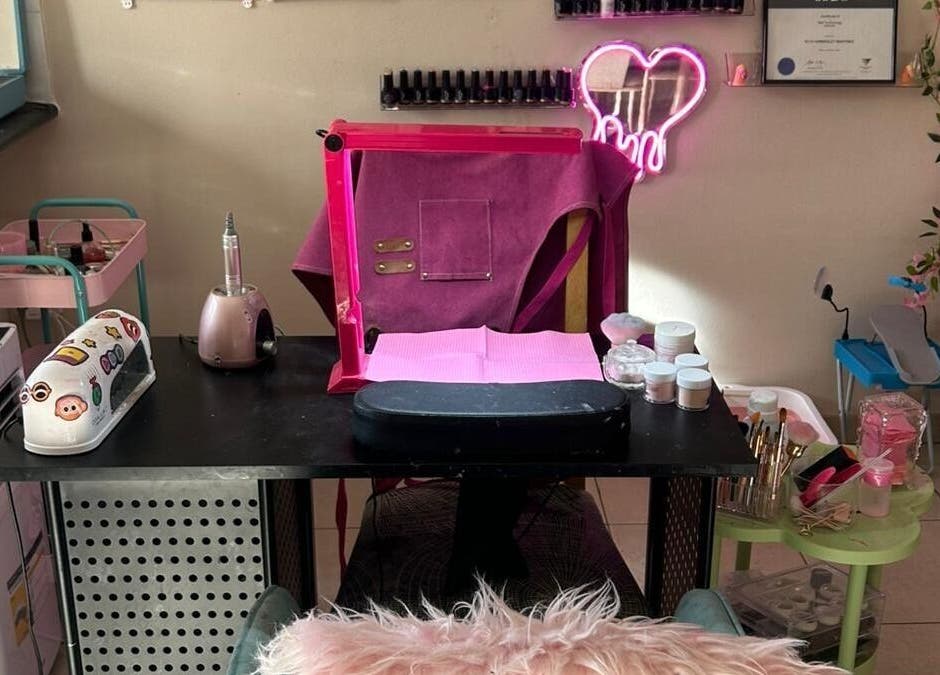 Elegant nail station at Nails By Ruth Kimberley, Merrylands, New South Wales, AU. Cozy setup with pink decor.