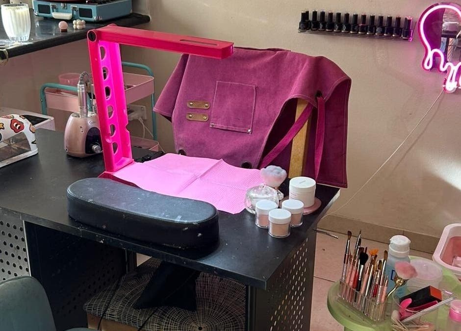 Stylish nail station at Nails By Ruth Kimberley, Merrylands, New South Wales, AU, featuring tools and pink decor.