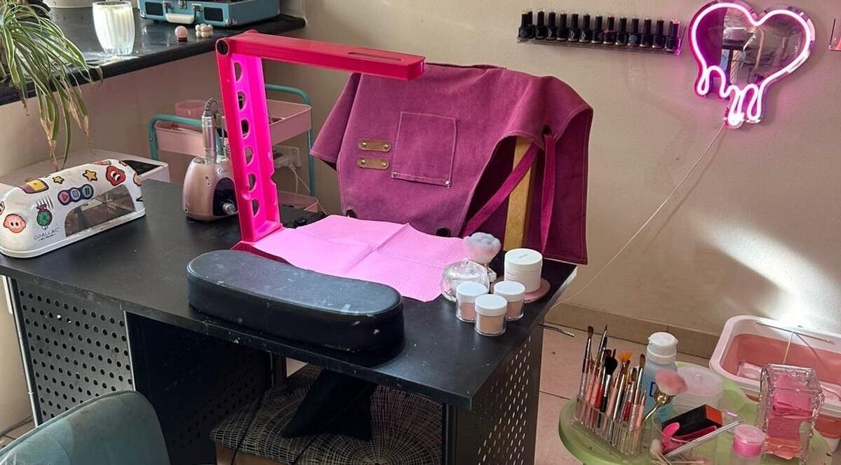 Stylish nail station at Nails By Ruth Kimberley, Merrylands, New South Wales, AU, featuring tools and pink decor.