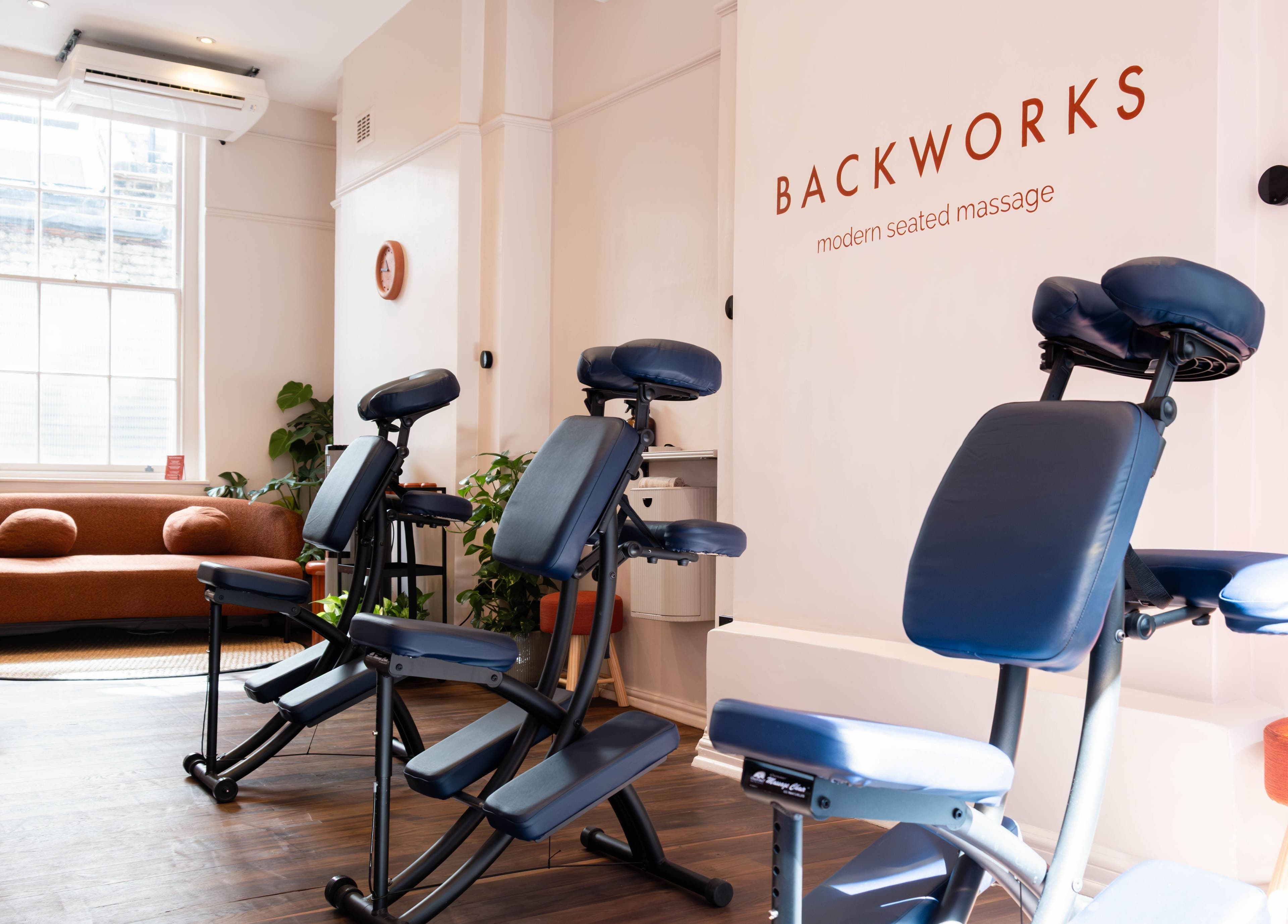 Backworks London GB massage area with comfortable seating and modern decor.