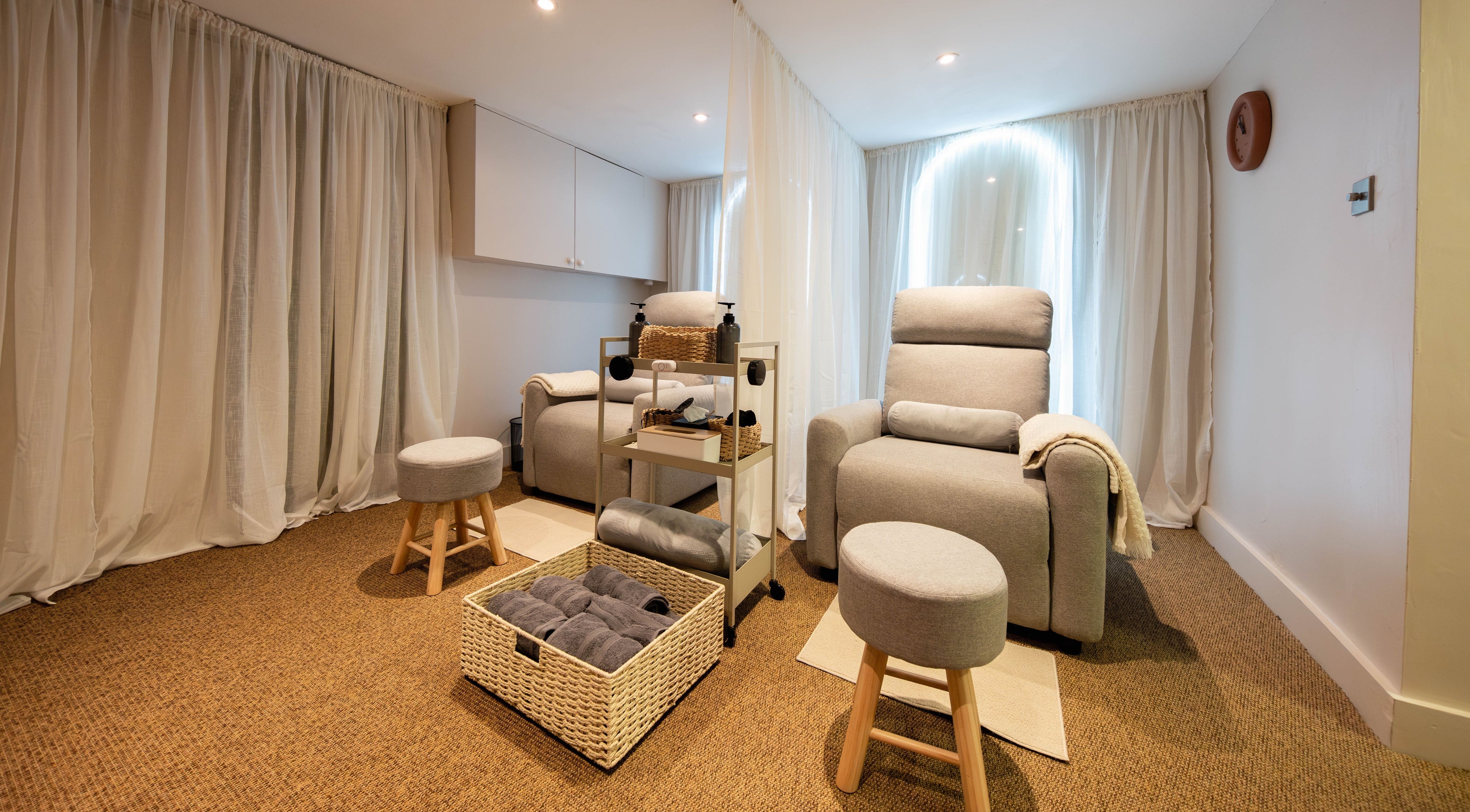 Cozy wellness lounge at Backworks, London, GB featuring plush seating and serene ambiance.