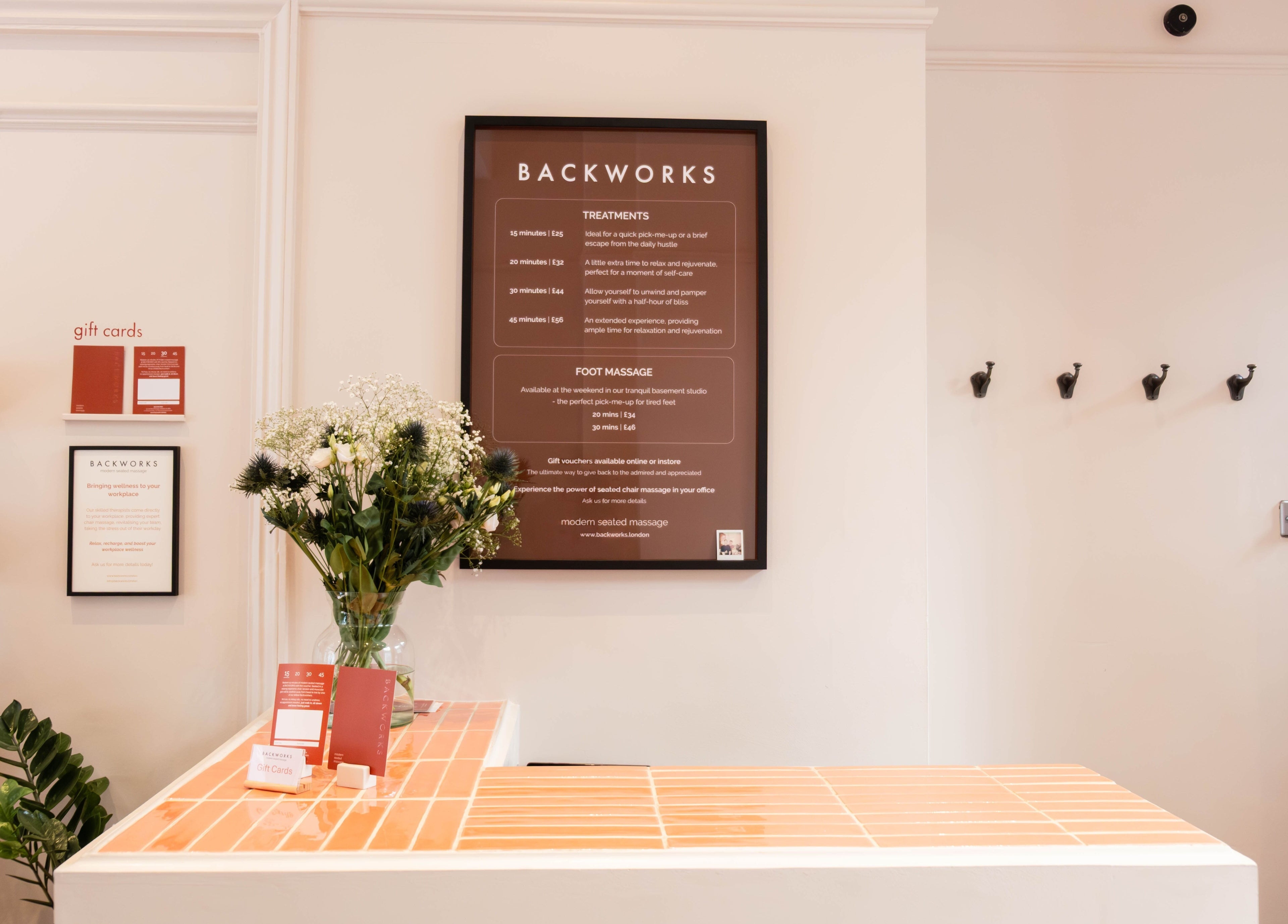 Backworks reception desk with gift cards and flowers in London, GB.