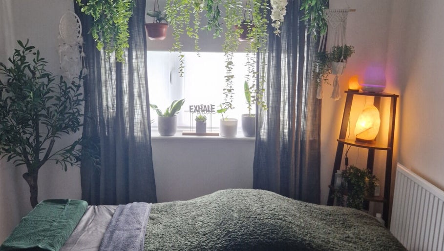 Soothing therapy room at Wellbeing with Jaydene at Jaydene’s Home, York, England, GB with warm lighting and plants.