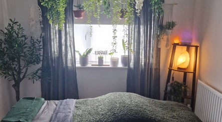 Soothing therapy room at Wellbeing with Jaydene at Jaydene’s Home, York, England, GB with warm lighting and plants.