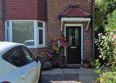 Entrance of Wellbeing with Jaydene at Jaydene’s Home, York, England, GB, featuring a vibrant garden.