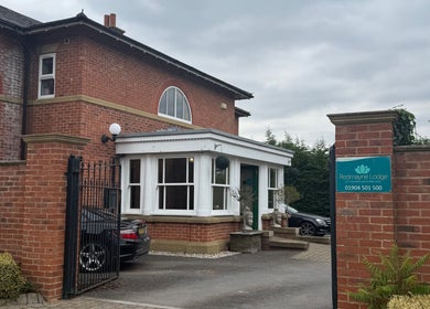 Entrance to Wellbeing with Jaydene at Redmayne Lodge in Strensall, England, GB. Brick building with sign visible.