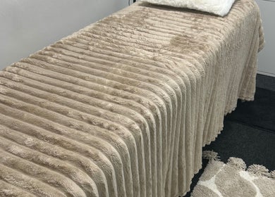 Luxurious treatment bed at Vanessa Santiago Body & Beauty, Dublin, County Dublin, IE, showcasing comfort.