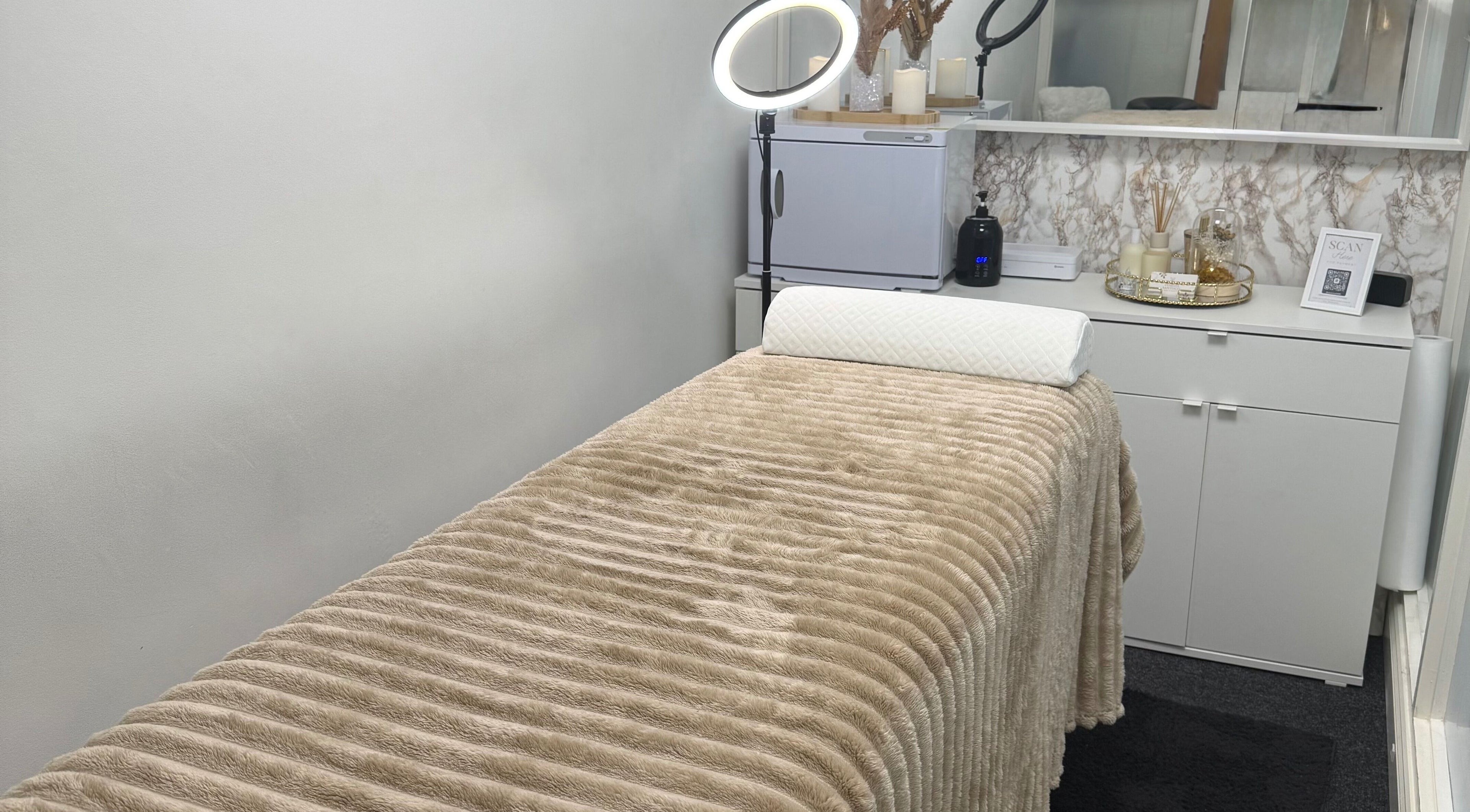 Relaxing treatment room at Vanessa Santiago Body & Beauty in Dublin, County Dublin, IE, featuring a cozy massage bed.