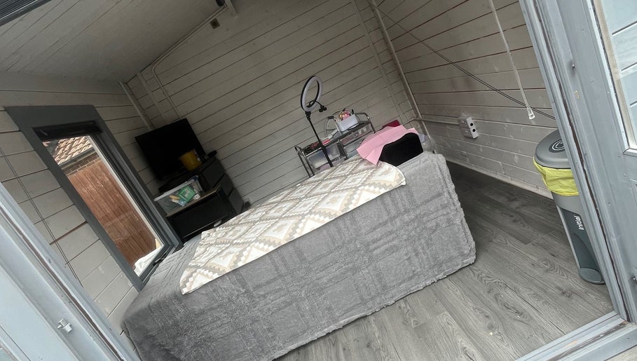 Cozy treatment room at Luscious Lashes, Gosport, England, GB, featuring stylish decor and a comfortable bed.