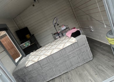 Cozy treatment room at Luscious Lashes, Gosport, England, GB, featuring stylish decor and a comfortable bed.