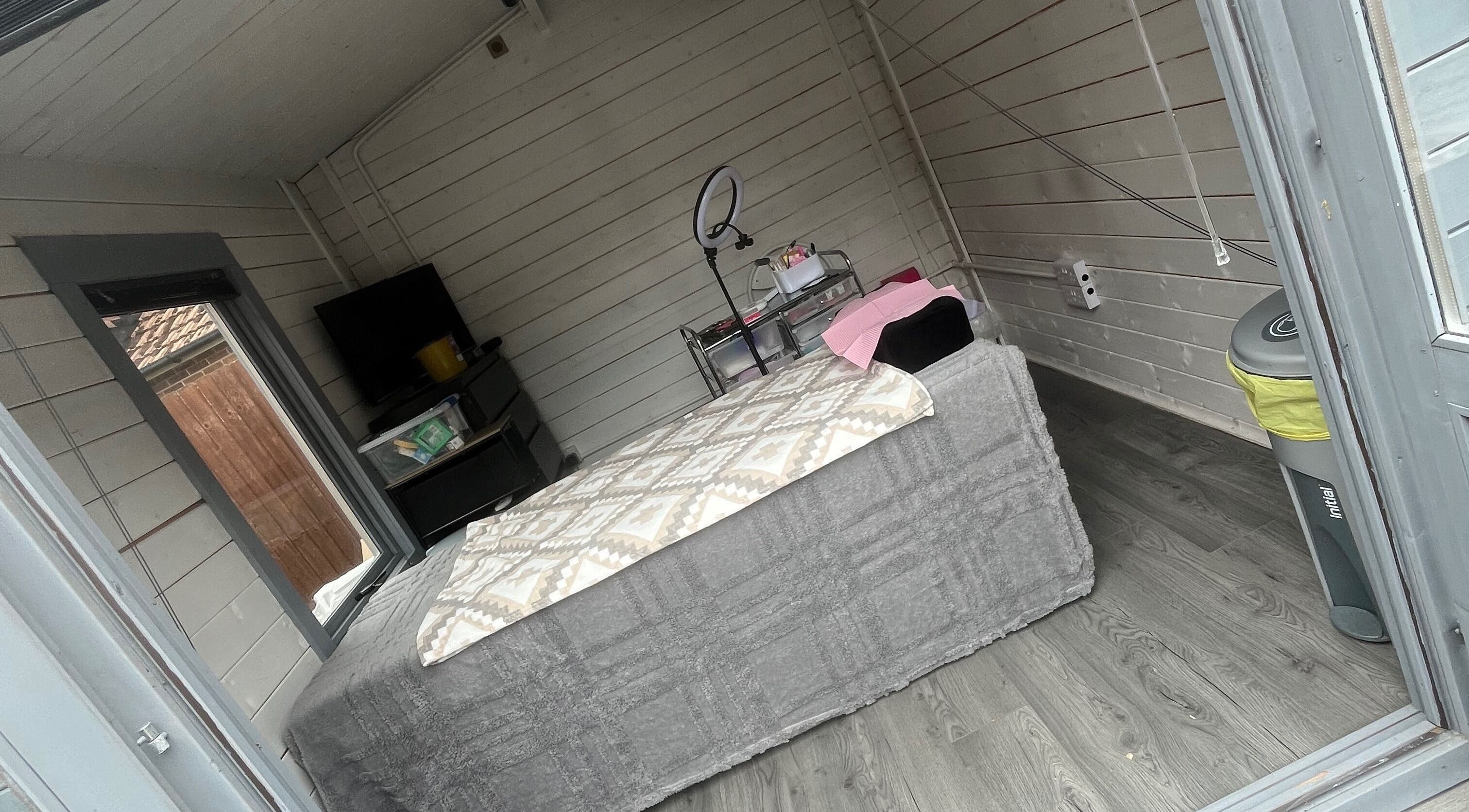 Cozy treatment room at Luscious Lashes, Gosport, England, GB, featuring stylish decor and a comfortable bed.
