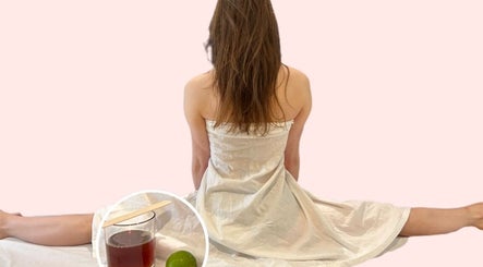 A serene woman in a white robe at Beauty Hour By V, St. Julian's, MT, prepared for a spa treatment.
