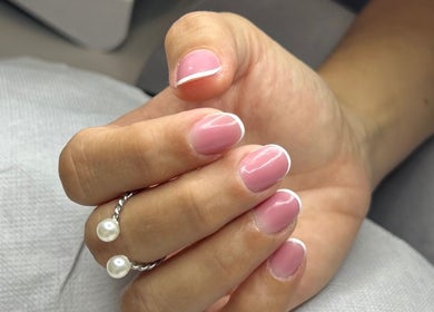 Pink French manicure at Beauty Hour By V, St. Julian's, MT, showcasing refined hand care.