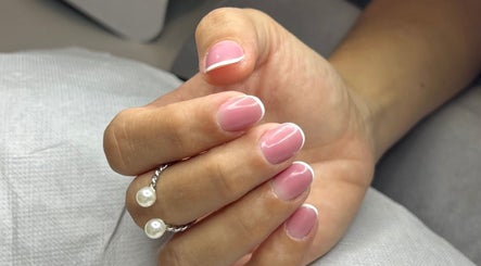 Pink French manicure at Beauty Hour By V, St. Julian's, MT, showcasing refined hand care.