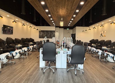 Interior view of Hana Nails Preston, Saskatoon, showcasing stylish nail stations and seating.