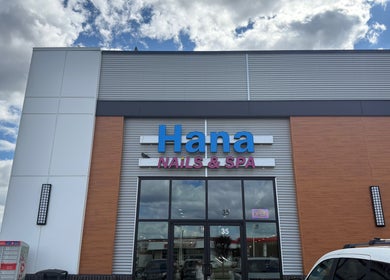 Hana Nails Preston entrance, Saskatoon, Saskatchewan, CA. Modern exterior with clear signage against sky backdrop.