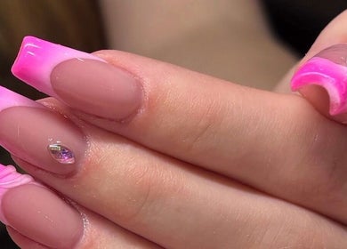 Vibrant pink ombre nails by Hana Nails Preston in Saskatoon, Saskatchewan, CA, showcasing elegance and style.