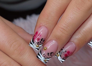Elegant nail art at Hana Nails Preston in Saskatoon, Saskatchewan, CA with floral and zebra patterns.