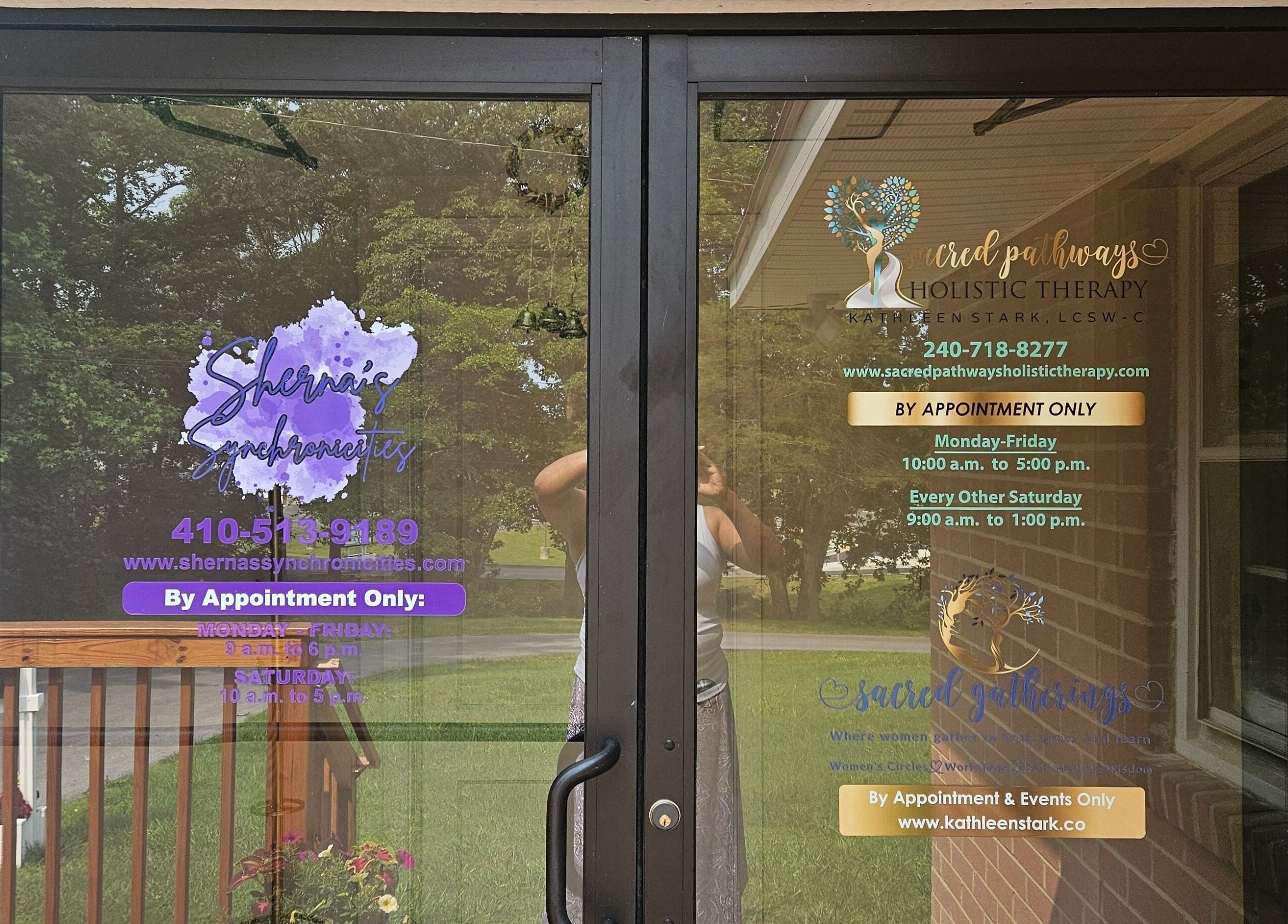 Entrance to Sherna's Synchronicities, LLC, California, Maryland, US with business hours displayed on glass doors.