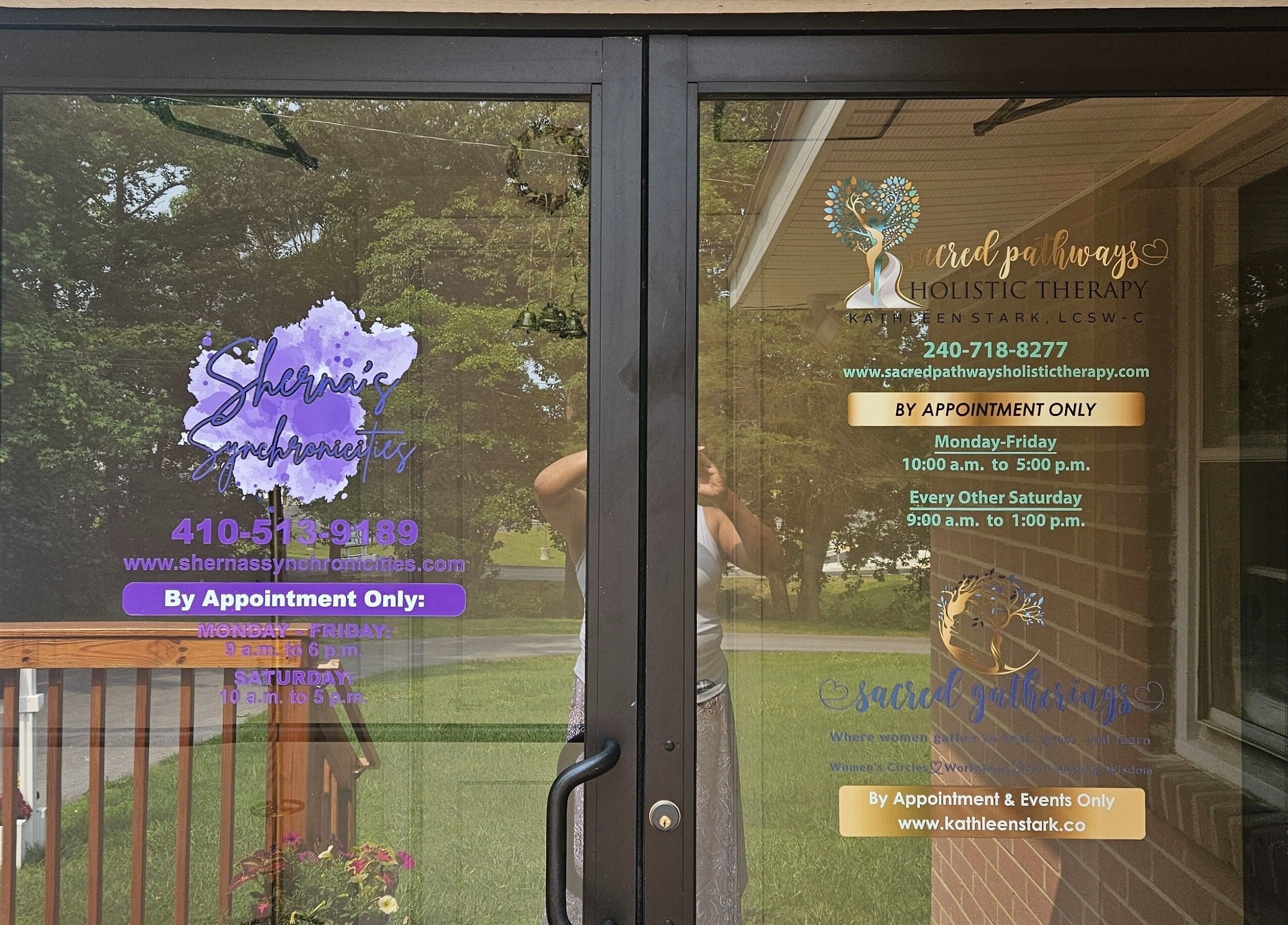 Entrance to Sherna's Synchronicities, LLC, California, Maryland, US with business hours displayed on glass doors.