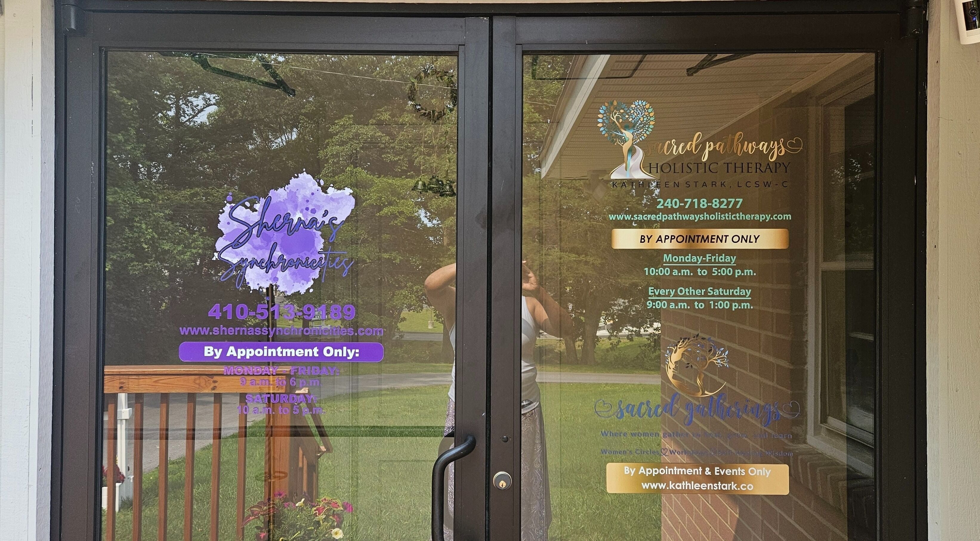 Entrance to Sherna's Synchronicities, LLC, California, Maryland, US with business hours displayed on glass doors.
