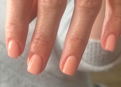 Beautiful peach manicure at The Mani X Muse, Alrewas, England, GB. Perfect for elegance and charm.