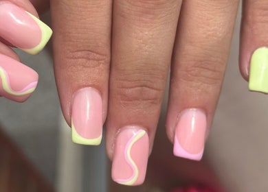 Bright neon nail art at The Mani X Muse, Alrewas, England, GB, featuring swirling pink and yellow designs.