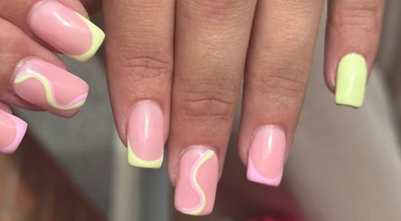 Bright neon nail art at The Mani X Muse, Alrewas, England, GB, featuring swirling pink and yellow designs.