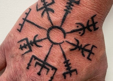 Intricate Nordic tattoo on hand at Otzi ink in Shipley, England, GB showcasing unique artistry.