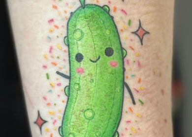 Colorful cucumber tattoo at Otzi Ink, Shipley, England, GB, showcasing vibrant design and creativity.
