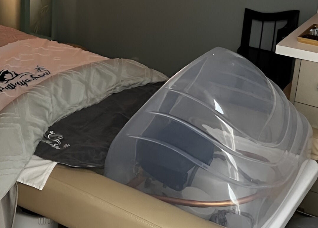 Luxurious treatment bed at Pattaya Spa in Pembroke Pines, Florida, US, featuring a modern wellness pod.