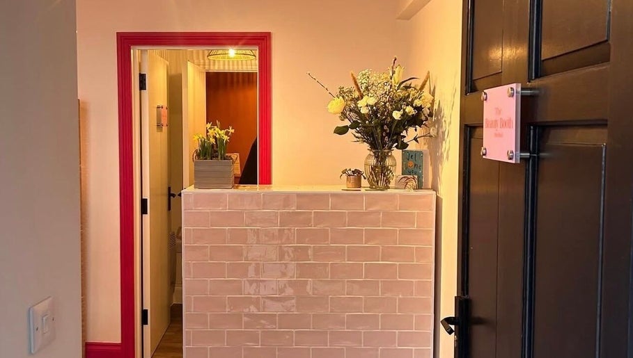 Reception area at Alexia Constantin Beauty in Hereford, England, GB, featuring elegant floral decor.