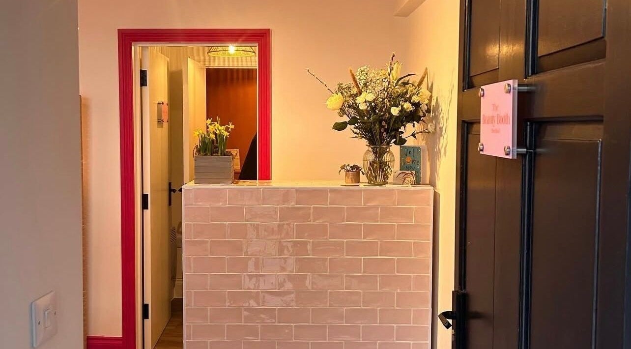 Reception area at Alexia Constantin Beauty in Hereford, England, GB, featuring elegant floral decor.