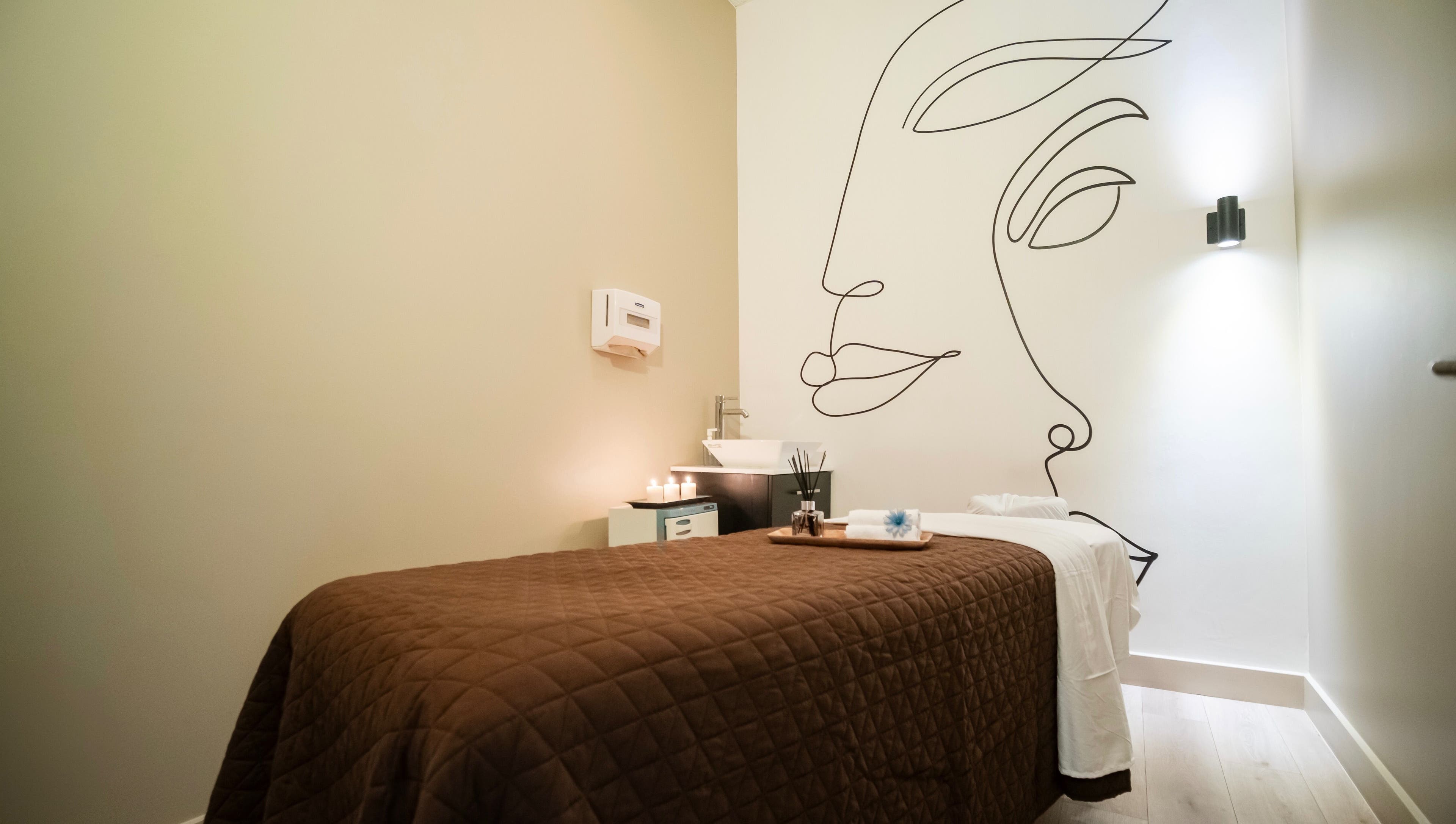 Relaxing spa room at The Balay Spa in North Vancouver, British Columbia, CA with calming decor and candles.