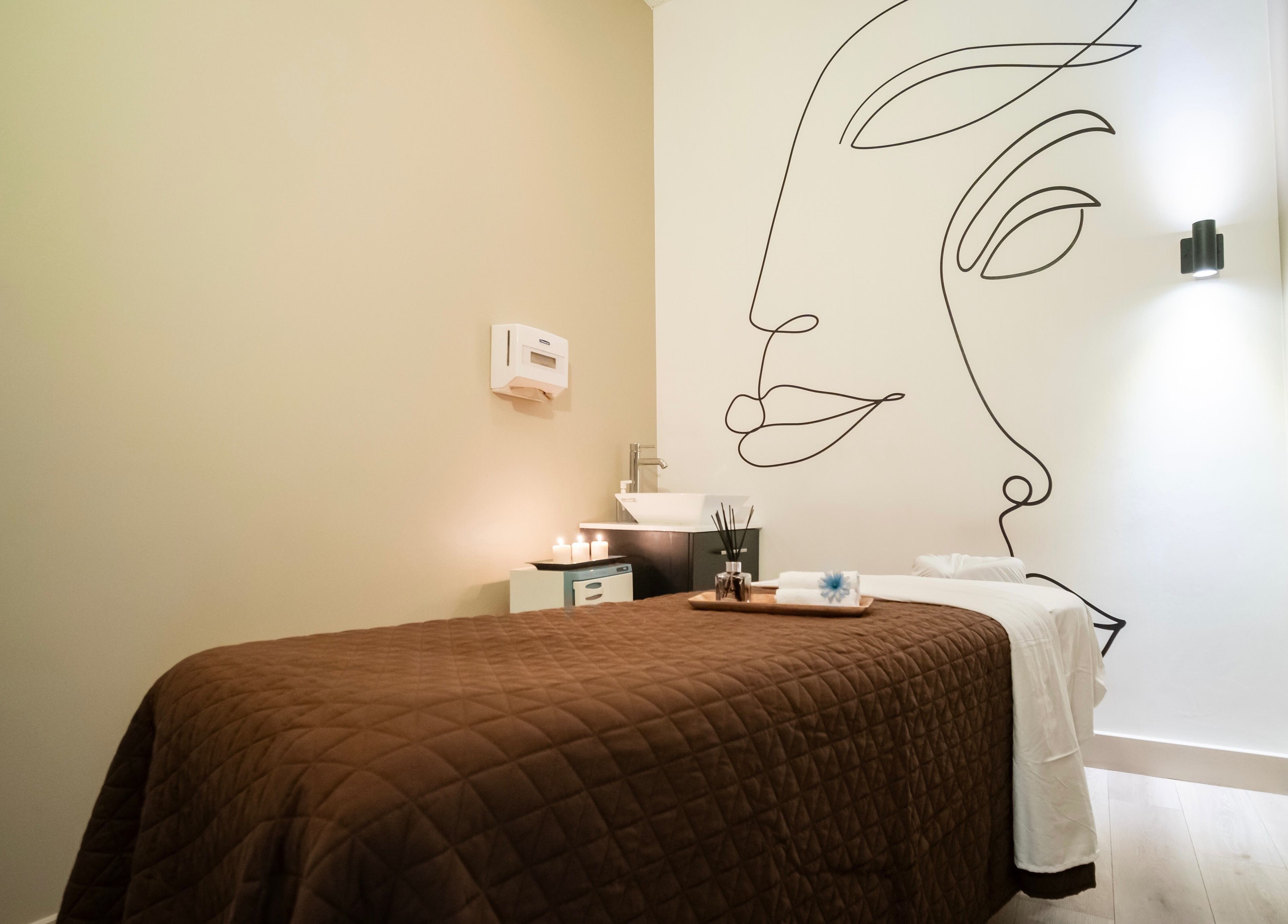 Relaxing spa room at The Balay Spa in North Vancouver, British Columbia, CA with calming decor and candles.