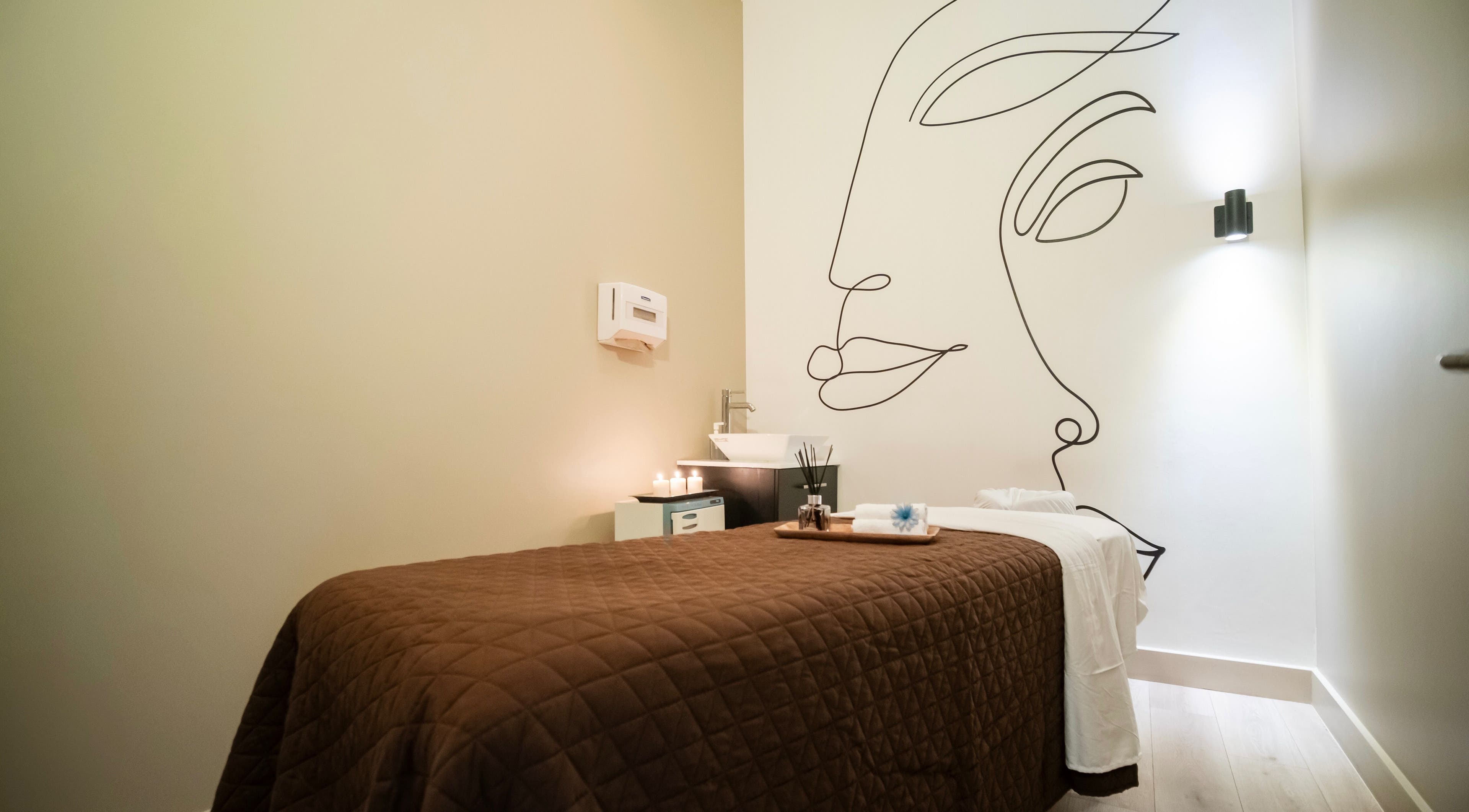Relaxing spa room at The Balay Spa in North Vancouver, British Columbia, CA with calming decor and candles.