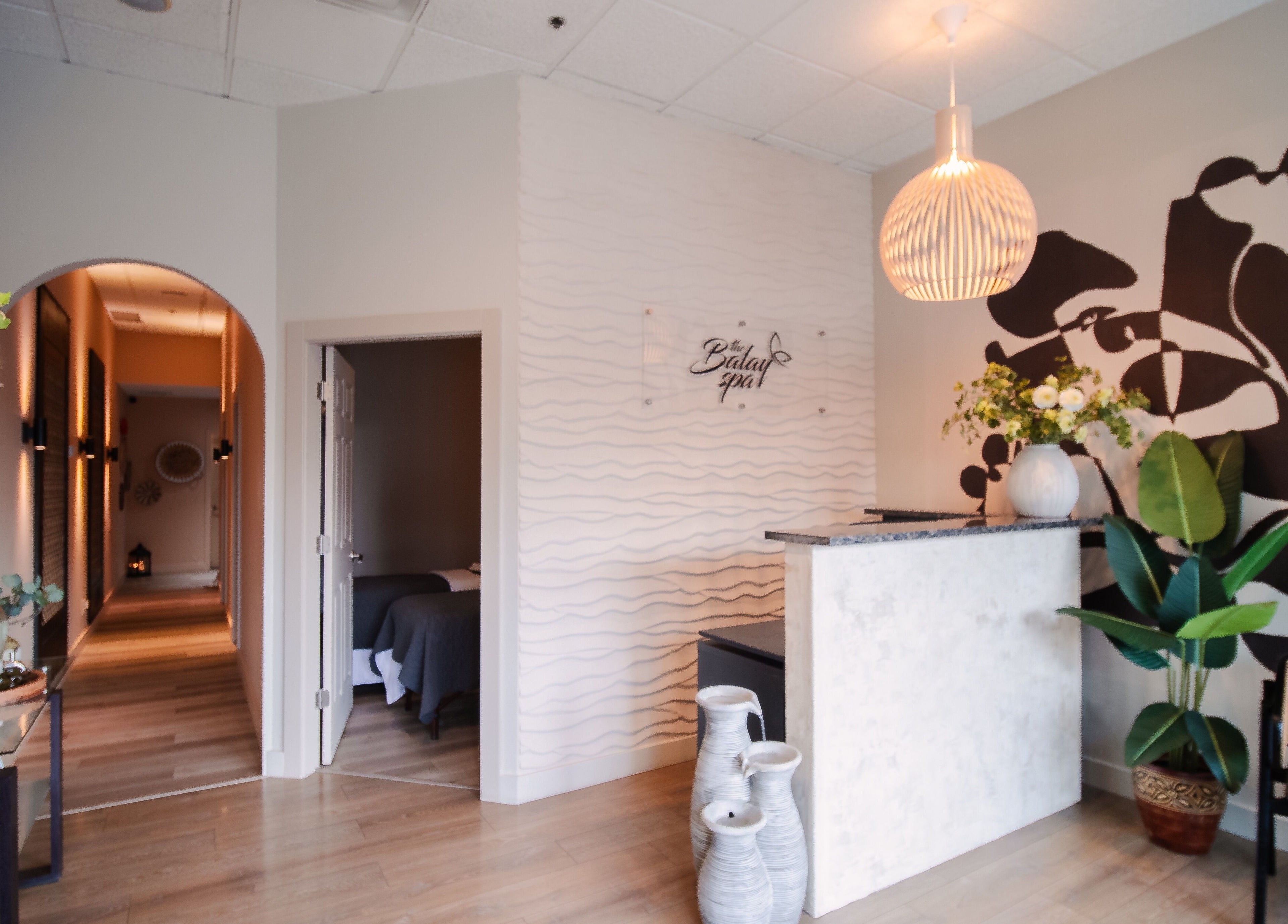 The Balay Spa reception area in North Vancouver, British Columbia, CA, featuring elegant decor and warm lighting.