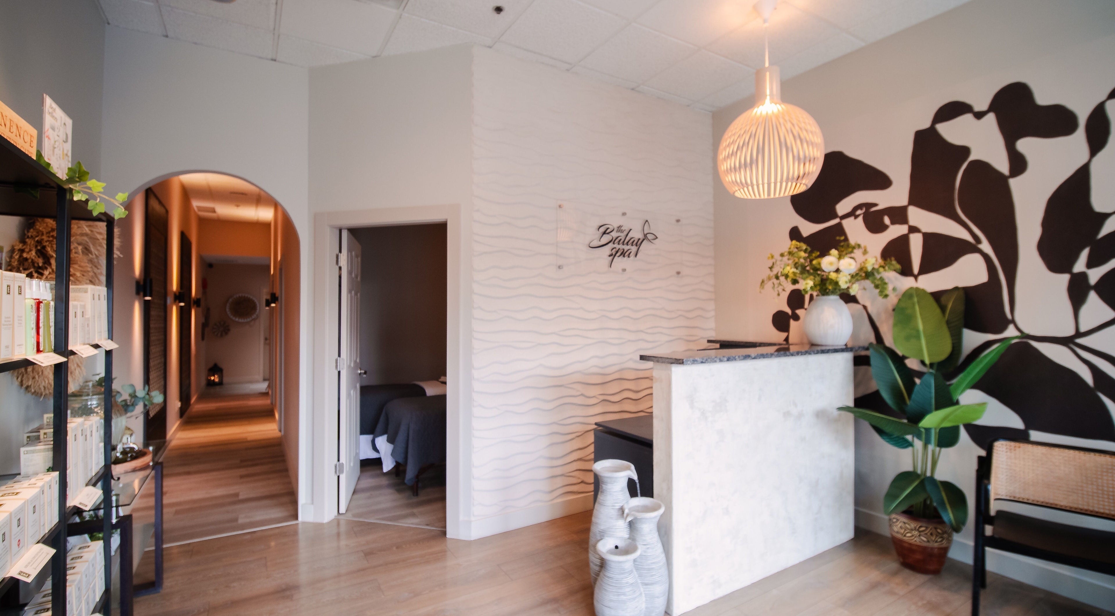 The Balay Spa reception area in North Vancouver, British Columbia, CA, featuring elegant decor and warm lighting.