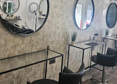 Elegant salon interior at Pamela Connor, Dundee, Scotland, GB, featuring stylish seating and modern decor.
